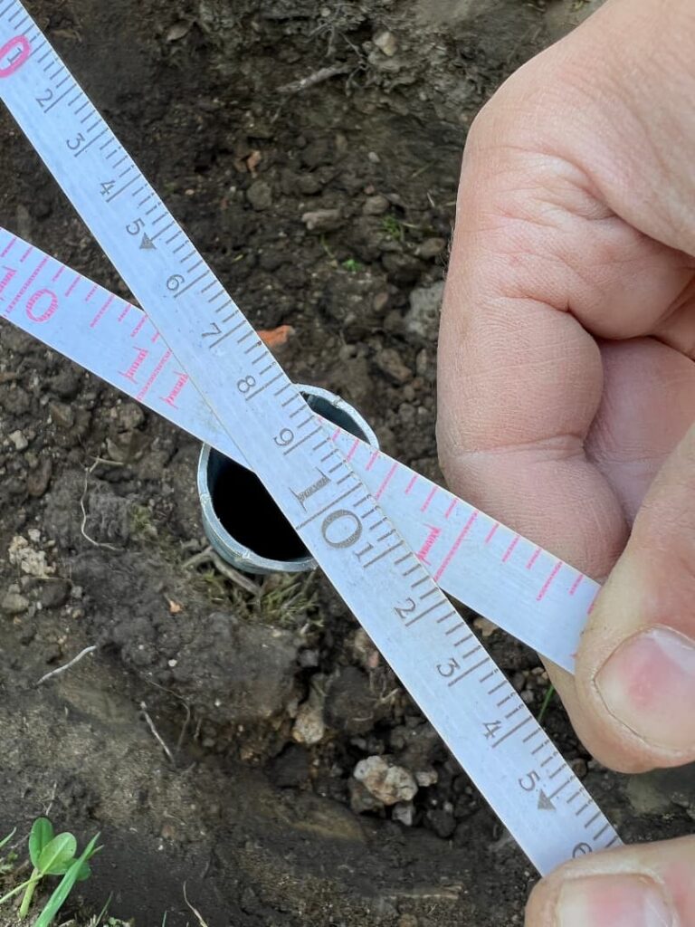 photo of two tape measures crossing over one another